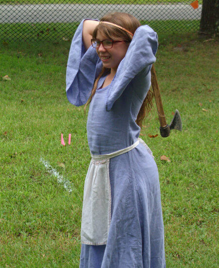 girl throwing an axe