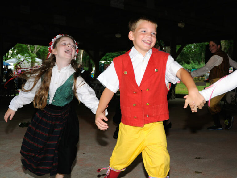kids holding hands and dancing