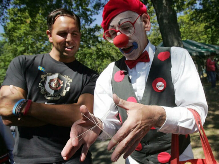 clown doing a trick with rubber bands