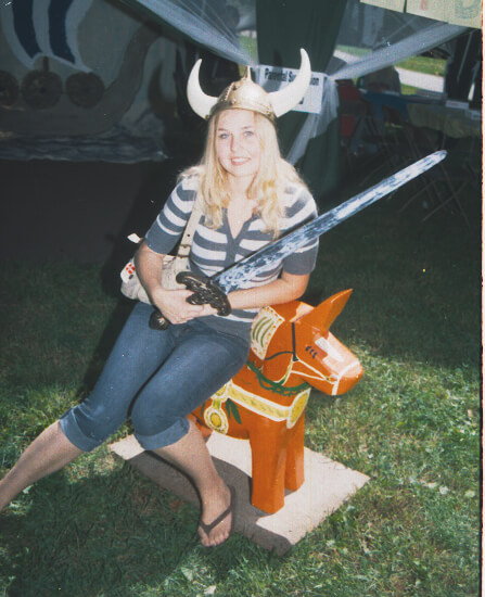 woman sitting on dala horse